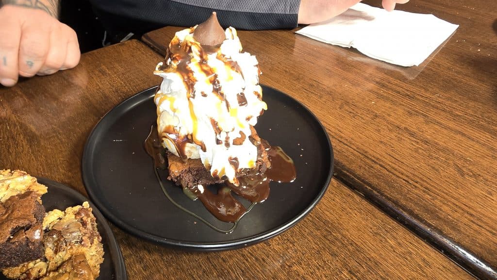 Hard scoop ice cream sundae with chocolate sauce